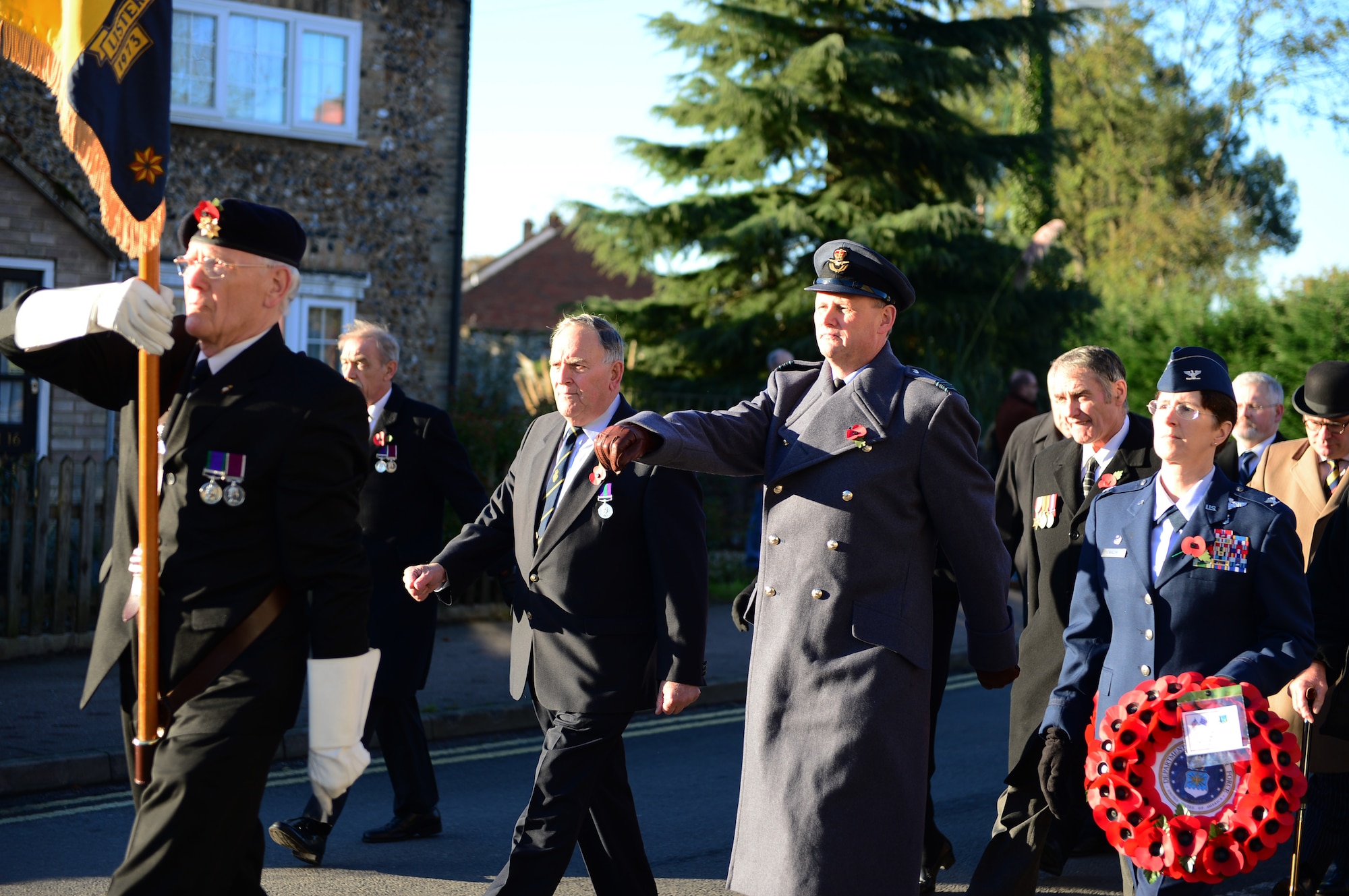 Sqn. Ldr. Jerry Neild, Royal Air Force commander, RAF Lakenheath, Col. Margaret Walsh, 48th Inpatient Operations Squadron commander march to the memorial site in Lakenheath, England, during the Remembrance Day parade, Nov. 10, 2013. The commonwealth observes Remembrance Day to honor the memories of men and women of the armed forces that have lost their lives in wars, past and present. (U.S. Air Force photo by Airman 1st Class Dawn M. Weber/Released)