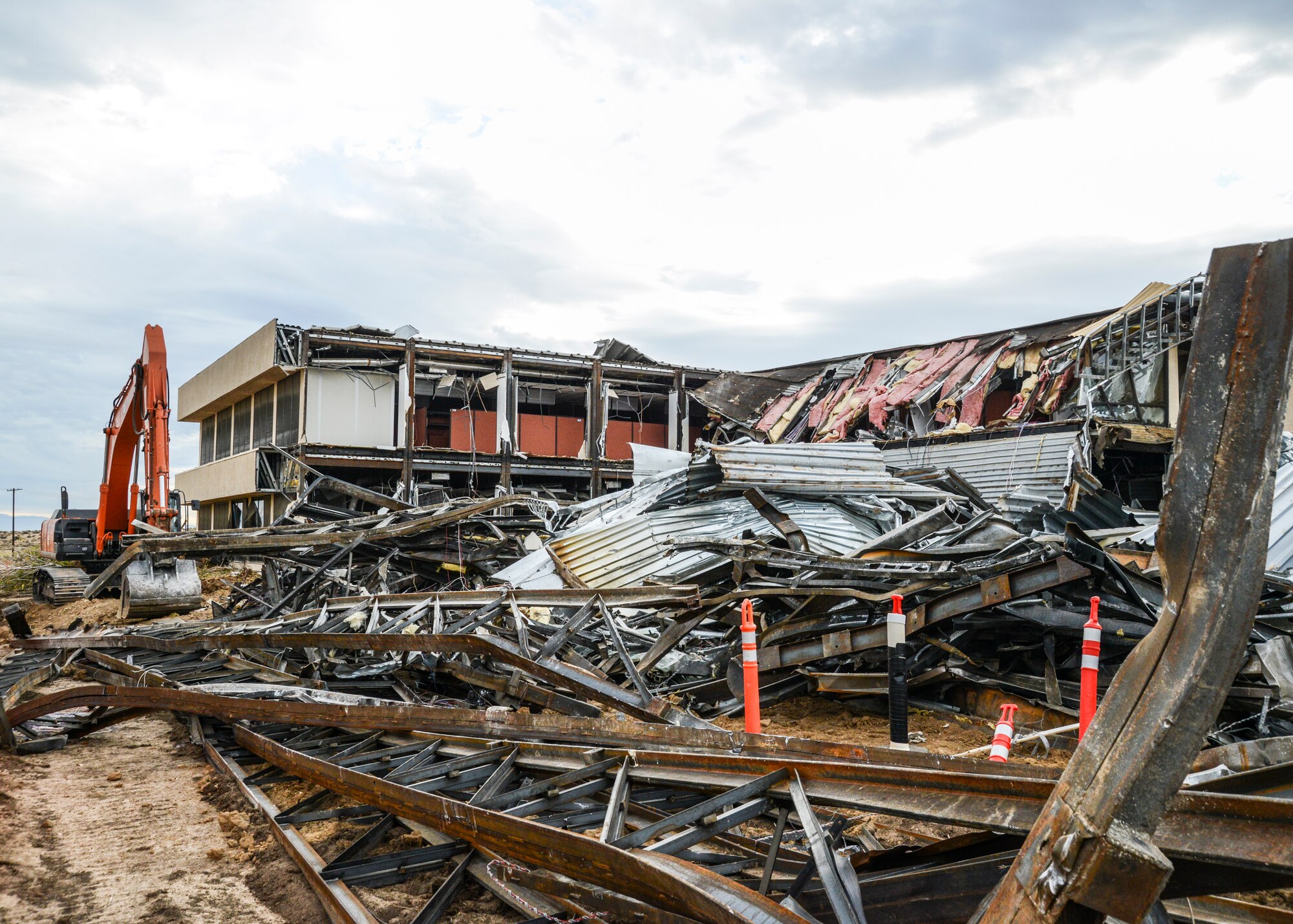 Six hours after construction a large section of the building was reduced to piles of recyclable metals. (U.S. Air Force photo by Rebecca Amber)
