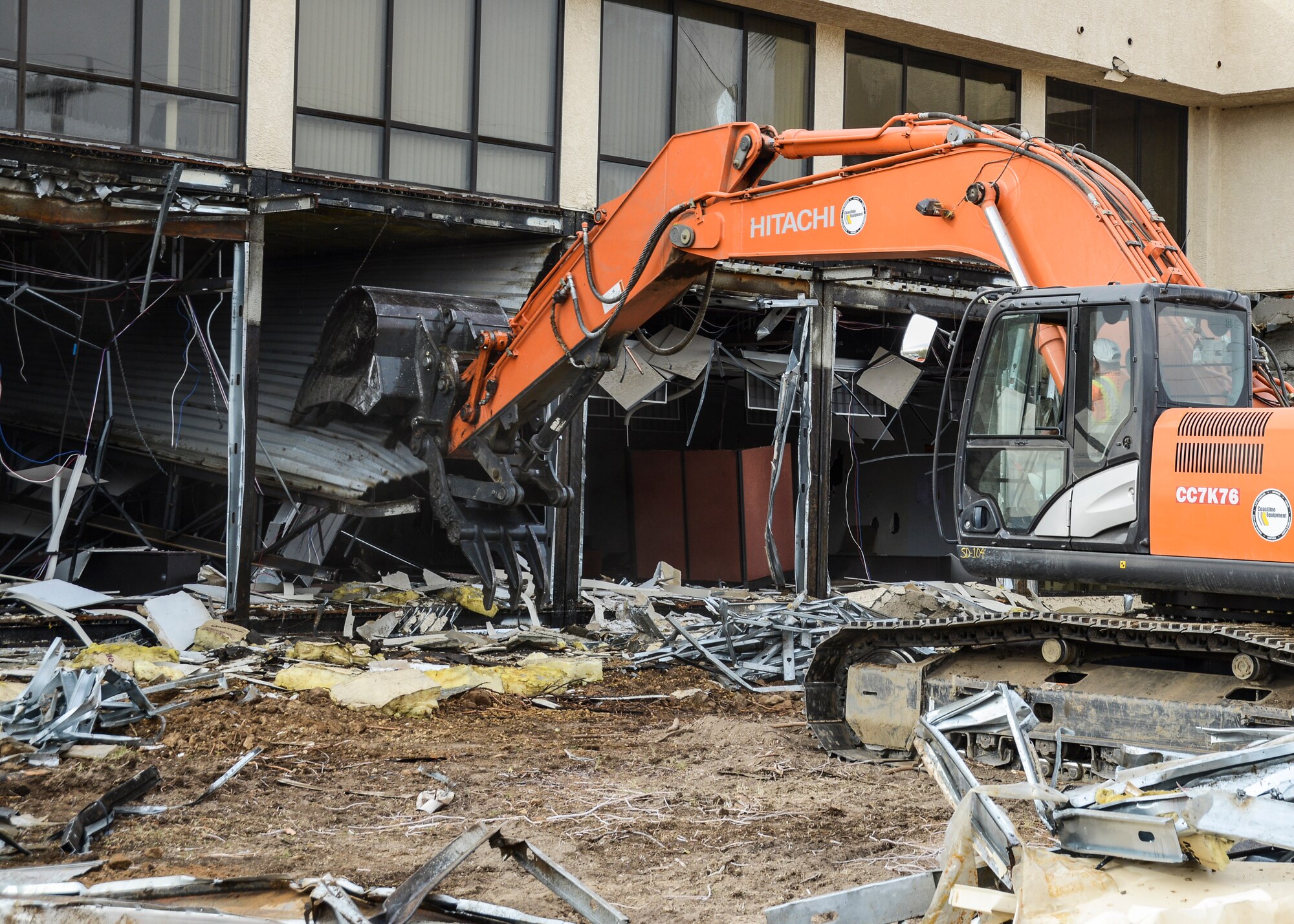 The construction team on the job, contractors from Burr Construction Inc., used an excavator to begin tearing down the structure. (U.S. Air Force photo by Rebecca Amber)
