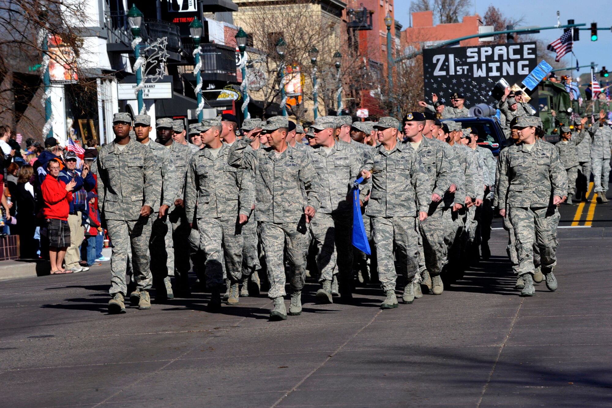 COLORADO SPRINGS, Colo. – Col. John Shaw, 21st Space Wing commander, leads a flight of 21st SW Airmen in the Colorado Springs Veterans Day parade Nov. 9. The annual parade honors those who have served and are still serving, and draws a crowd of thousands. (U.S. Air Force photo/Robb Lingley)