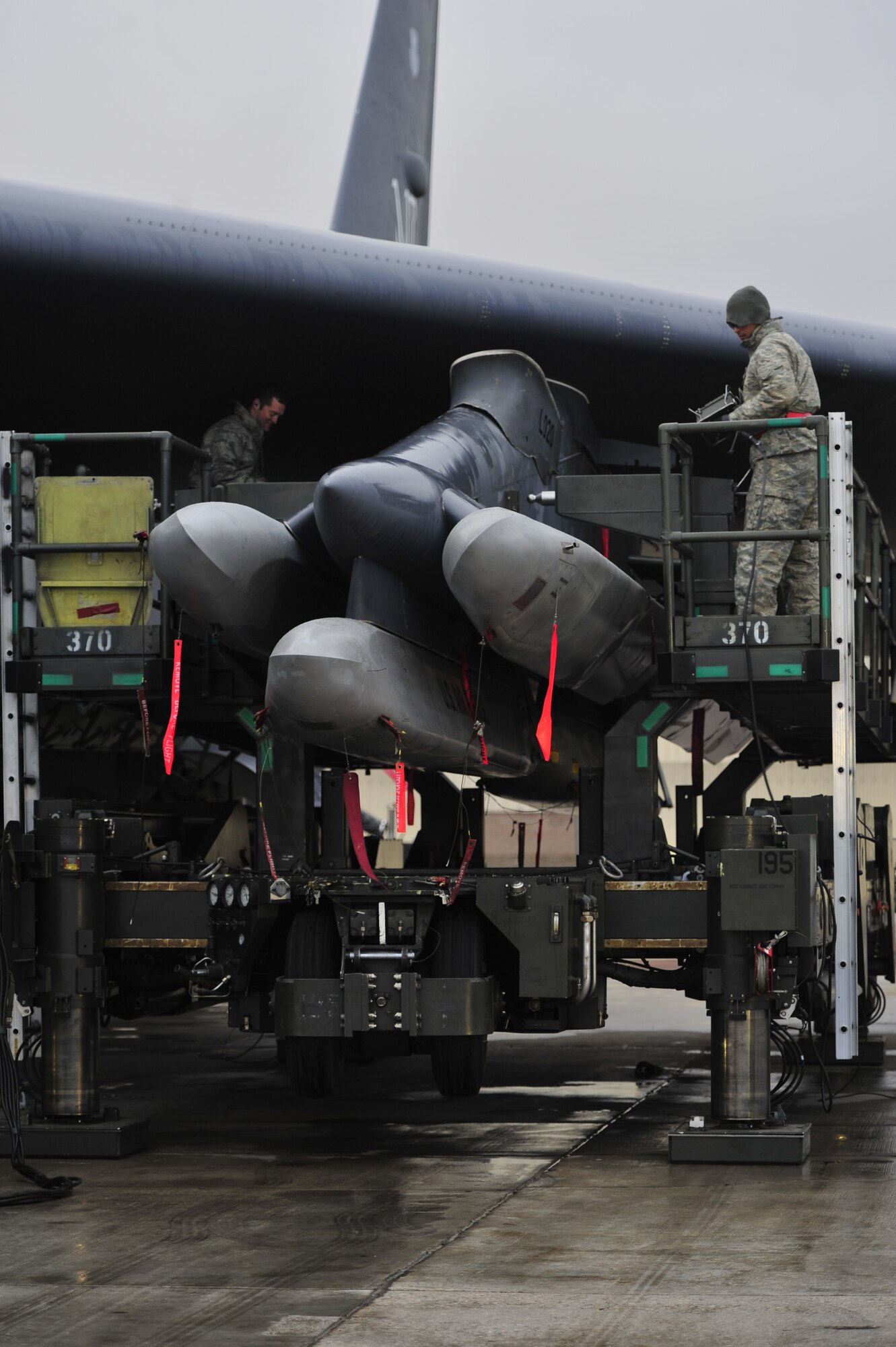 Airmen from the 5th Maintenance Group make final inspections on the missiles on a B-52H Stratofortress, Nov. 1, 2013. The team was preparing the jet’s assets for a rapid launch, which was part of a Nuclear Operational Readiness Inspection. (U.S. Air Force photo/Senior Airman Kristoffer Kaubisch)
