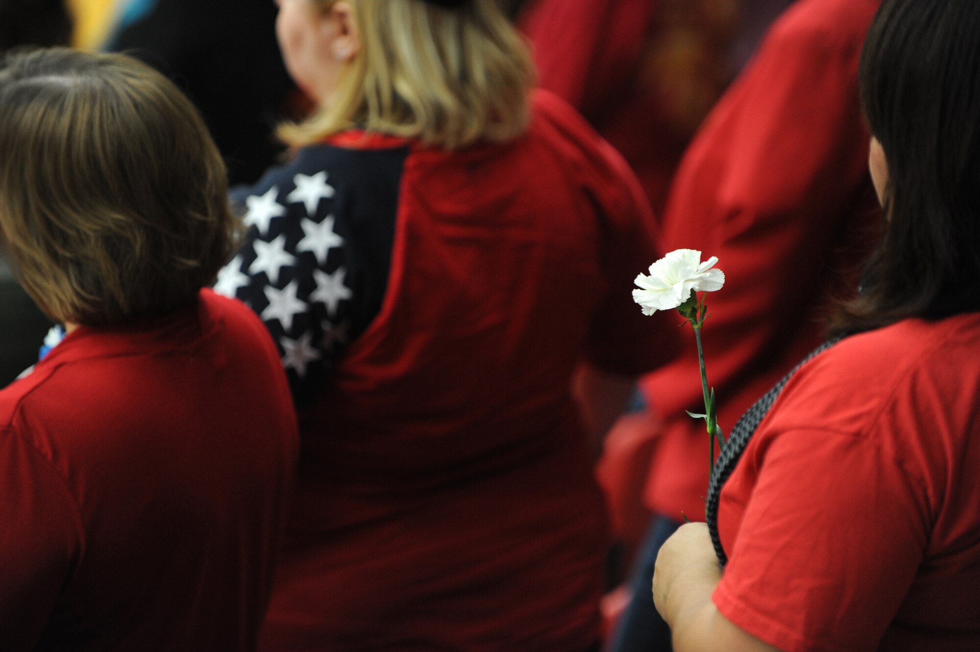 A white carnation is held by a woman veteran Nov. 11, 2013, at the University of Central Missouri’s Veterans Day ceremony in Warrensburg, Mo. According to the Veterans Administration, women make up almost 12 percent of veterans from operations Enduring Freedom, Iraqi Freedom and New Dawn. (U.S. Air Force photo by Staff Sgt. Brigitte N. Brantley/Released)