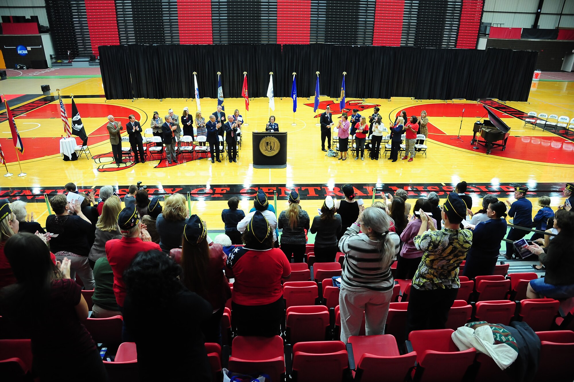 U.S. Air Force Lt. Col. Beth Makros, 394th Combat Training Squadron commander, is greeted by applause as she takes the stage Nov. 11, 2013, at the University of Central Missouri’s Veterans Day ceremony in Warrensburg, Mo. The theme, “Honoring Our Women Veterans,” celebrated all the contributions women have made to U.S. military operations. (U.S. Air Force photo by Staff Sgt. Brigitte N. Brantley/Released)