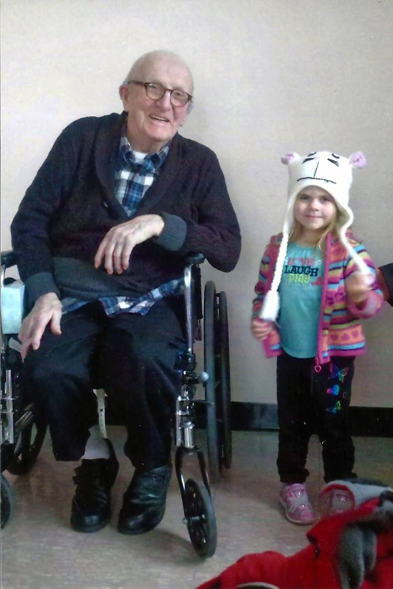HOLYOKE, Mass. –Retired Tech. Sgt. Emil Dihlmann poses for a picture with his great granddaughter at the Soldier’s Home in Holyoke, Mass., in early 2013. Dihlmann served at RAF Alconbury from 1943 to 1945 and he had such fond memories of his time there that his family asked if they could spread his ashes on the base after he passed away June 27 at the age of 96. (Photo courtesy of Emily Lewney)