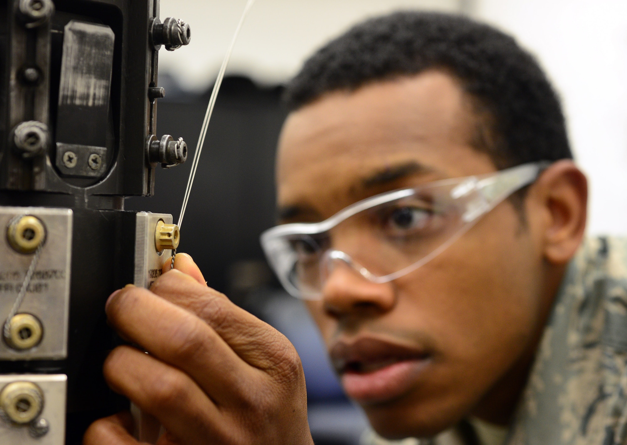 Senior Airman Brandon Alexander, 31st Munitions Squadron armament technician, inspects a gun system, Nov. 5, 2013, at Aviano Air Base, Italy. The armament section is accountable for 1,500 different parts of equipment. (U.S Air Force photo/Senior Airman Matthew Lotz)