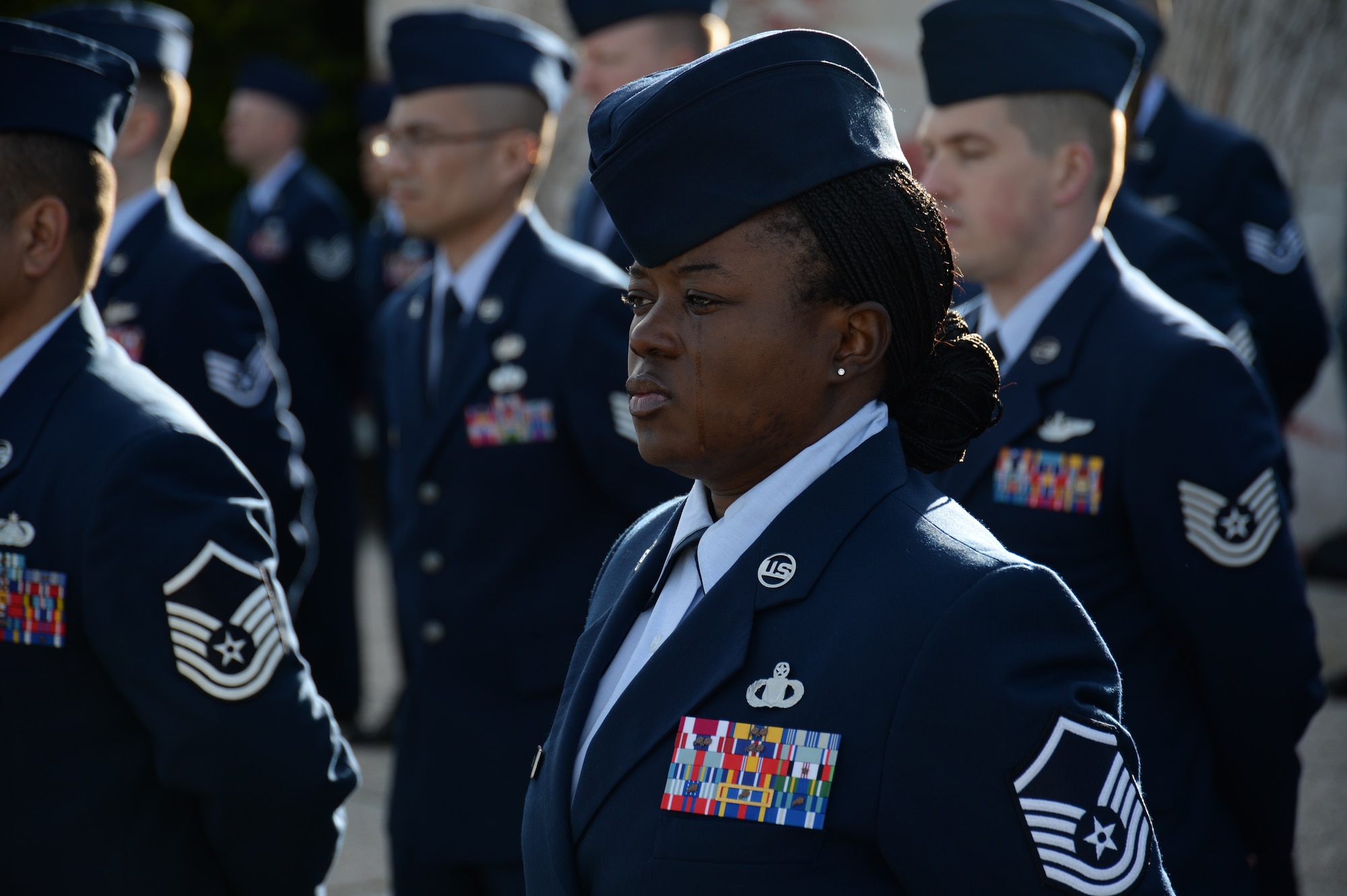HOMBOURG, Belgium --- U.S. Air Force Master Sgt. Shaneeka Jones, superintendent of flight records from the 470th Air Base Squadron at NATO Air Base Geilenkirchen, Germany, stands at parade rest during a Veterans Day memorial ceremony at the Henri-Chapelle American Cemetery Nov. 11, 2013. More than 40 American service members participated in the ceremony before nearly 100 attendees to honor the service and sacrifice of American veterans. (U.S. Air Force photo by Staff Sgt. Joe W. McFadden/Released)