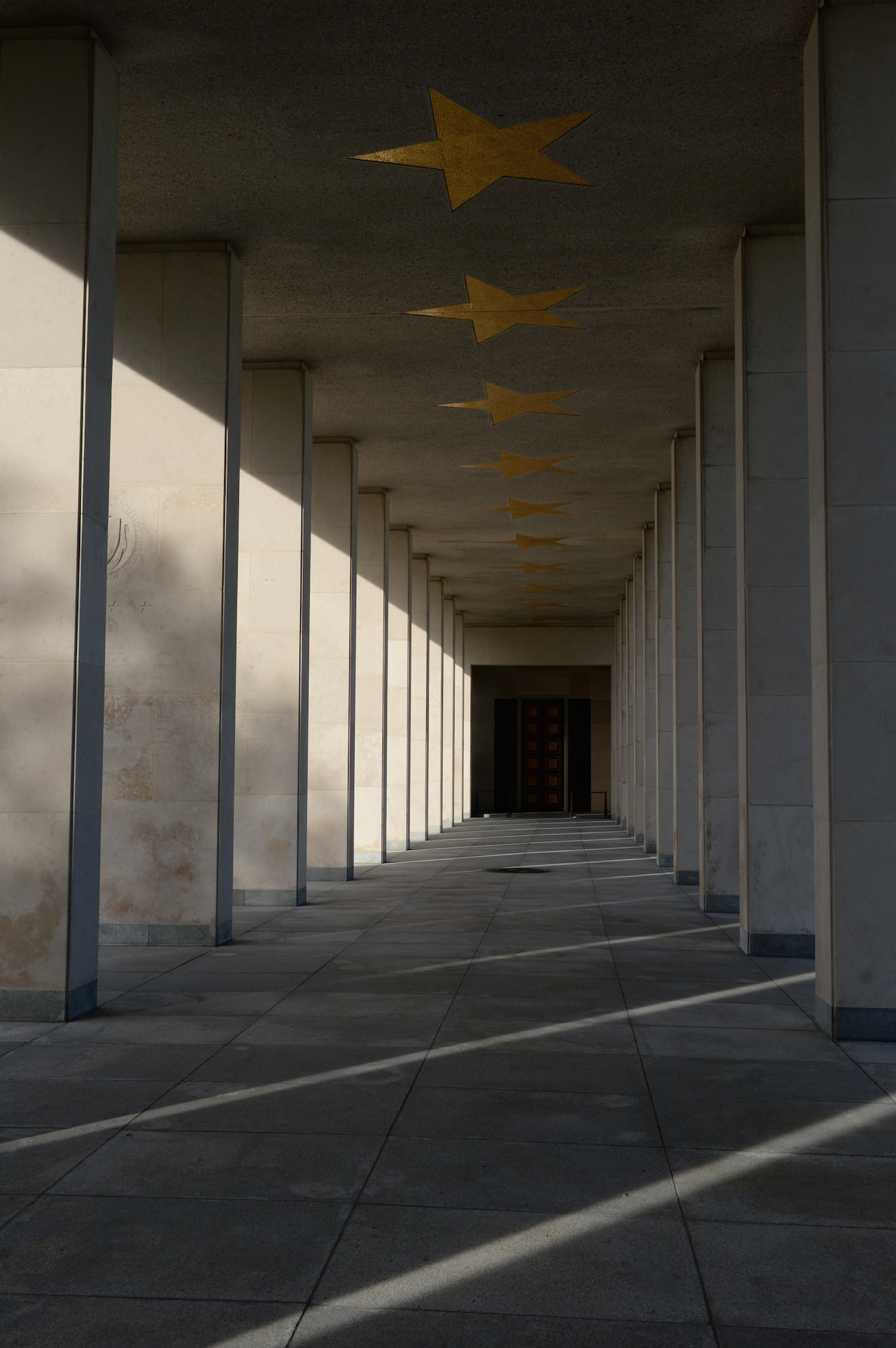 HOMBOURG, Belgium --- The promenade bearing the names of more than 400 American service members stands at the Henri-Chapelle American Cemetery Nov. 11, 2013. More than 40 U.S. Air Force Airmen and U.S. Navy Sailors gathered at the cemetery to honor the legacy of the 4,992 American service members interred at the site. (U.S. Air Force photo by Staff Sgt. Joe W. McFadden/Released)