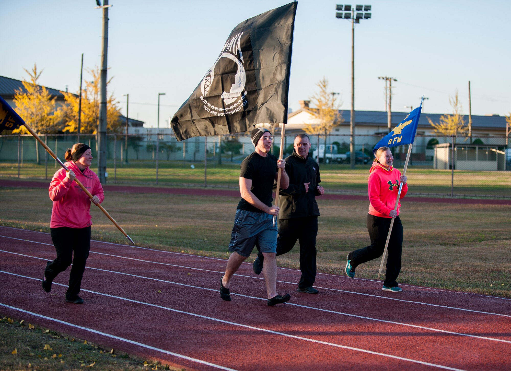Members of the 8th Security Forces Squadron take part in the Veterans Day Vigil at Kunsan Air Base, Republic of Korea, Nov. 11, 2013. The Wolf Pack observed the sacrifices of all veterans during a 12 hour vigil at the fitness center track. (U.S. Air Force photo by Senior Airman Clayton Lenhardt/Released)