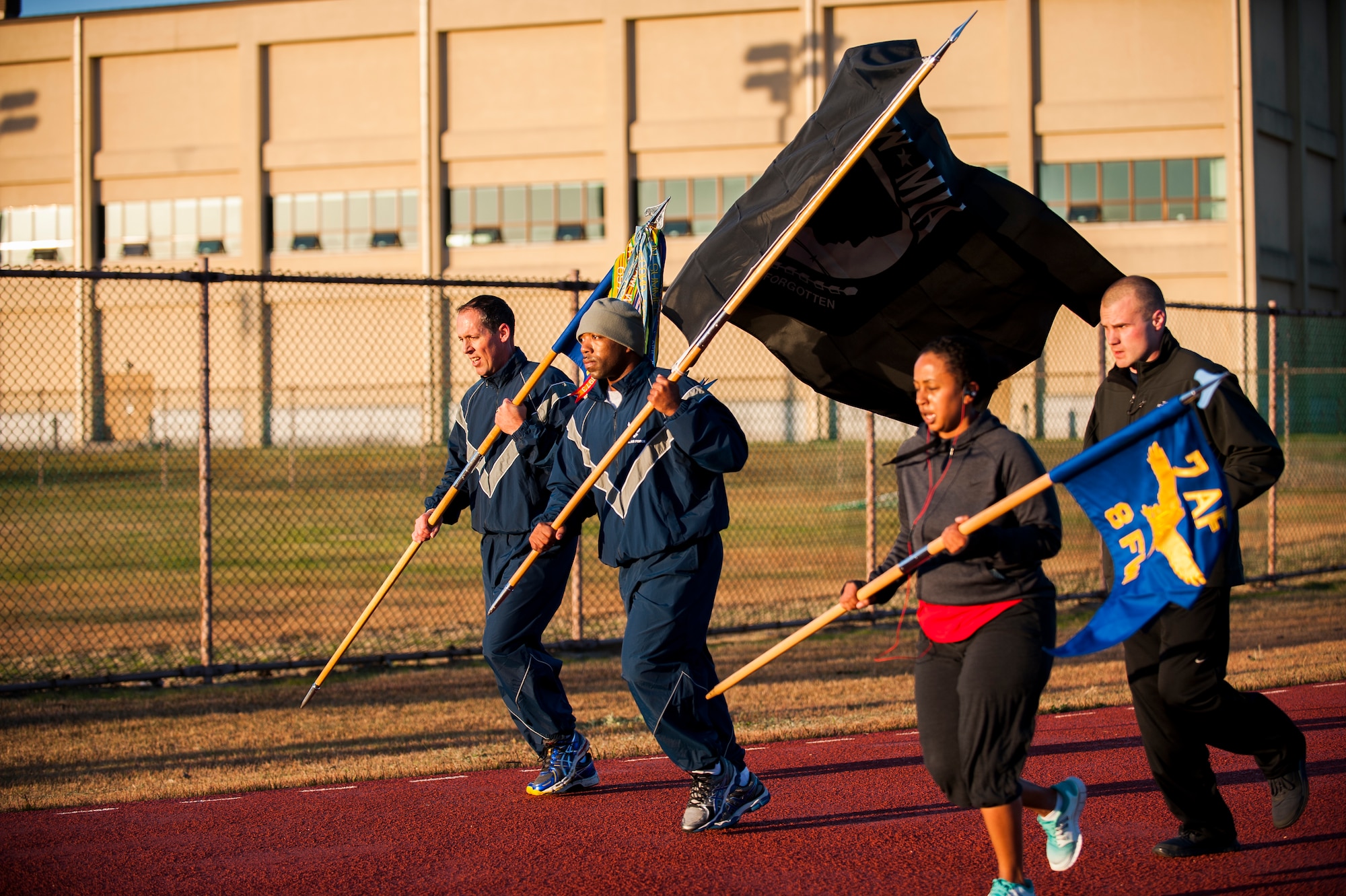 Members of the 8th Security Forces Squadron take part in the Veterans Day Vigil at Kunsan Air Base, Republic of Korea, Nov. 11, 2013. The Wolf Pack observed the sacrifices of all veterans during a 12-hour vigil at the fitness center track. (U.S. Air Force photo by Senior Airman Clayton Lenhardt/Released)