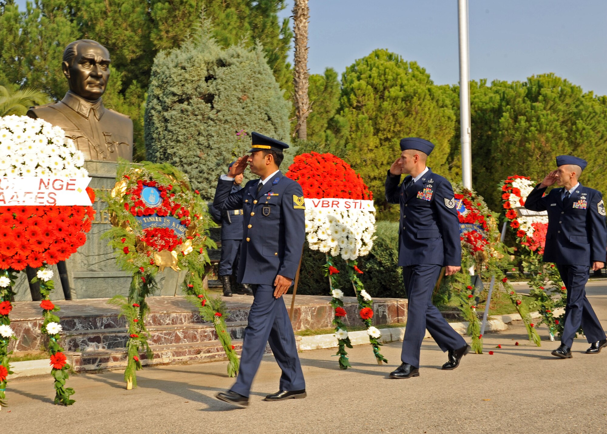Turkish airmen and U.S. Airmen of Incirlik Air Base salute a monument of Mustafa Kemal Ataturk during the Ataturk Memorial Day Ceremony Nov. 10, 2013, at Incirlik Air Base, Turkey. Turkish and U.S. Airmen gathered to honor Ataturk, the founder and first president of modern Turkey, on the 75th anniversary of his death. (U.S. Air Force photo by Senior Airman Chase Hedrick/Released)