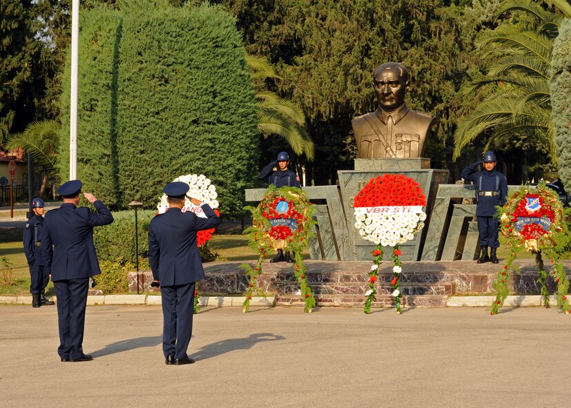 Col. Brent Bigger, 39th Air Base Wing vice commander, and Turkish air force Col. Necip Yilmaz, 101st Operations Squadron commander, salute a monument of Mustafa Kemal Ataturk during the Ataturk Memorial Day Ceremony Nov. 10, 2013, at Incirlik Air Base, Turkey. Ataturk became an important statesman in Turkey after years of struggle and strife when he proposed constitutional amendments Oct. 29, 1923, which would serve as a foundation for the new republic. (U.S. Air Force photo by Senior Airman Chase Hedrick/Released)