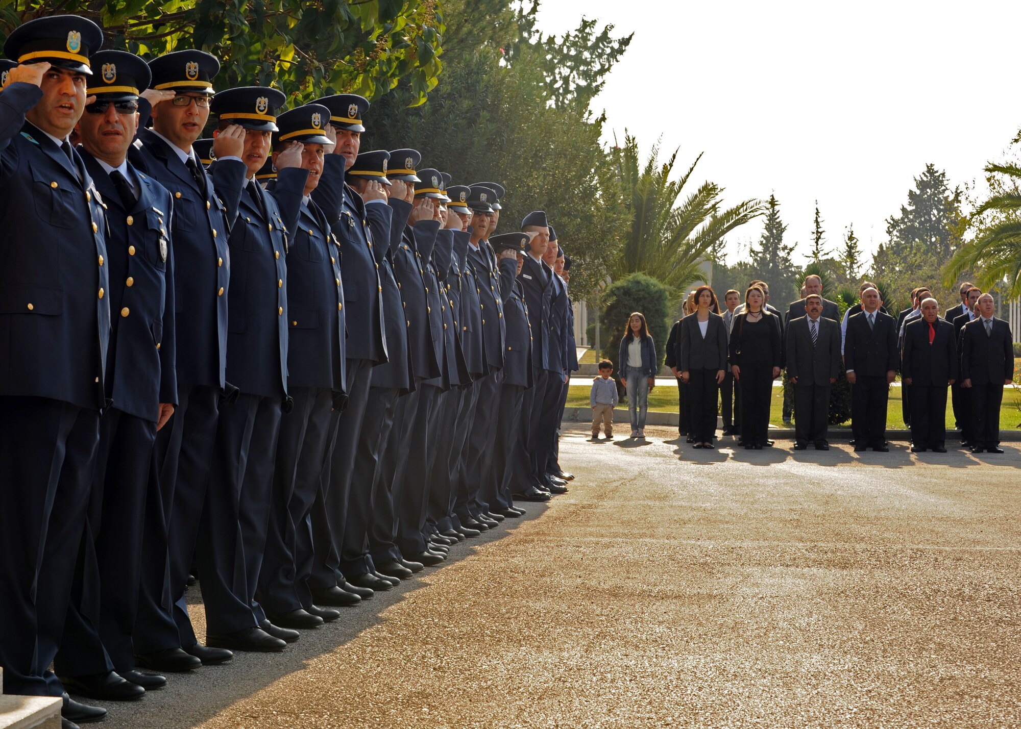 Turkish airmen and civilians of the 10th Tanker Base Command sing the Turkish national anthem alongside U.S. Airmen during the Ataturk Memorial Day Ceremony Nov. 10, 2013, at Incirlik Air Base, Turkey. Mustafa Kemal Ataturk was the founder and first president of modern Turkey. (U.S. Air Force photo by Senior Airman Chase Hedrick/Released)