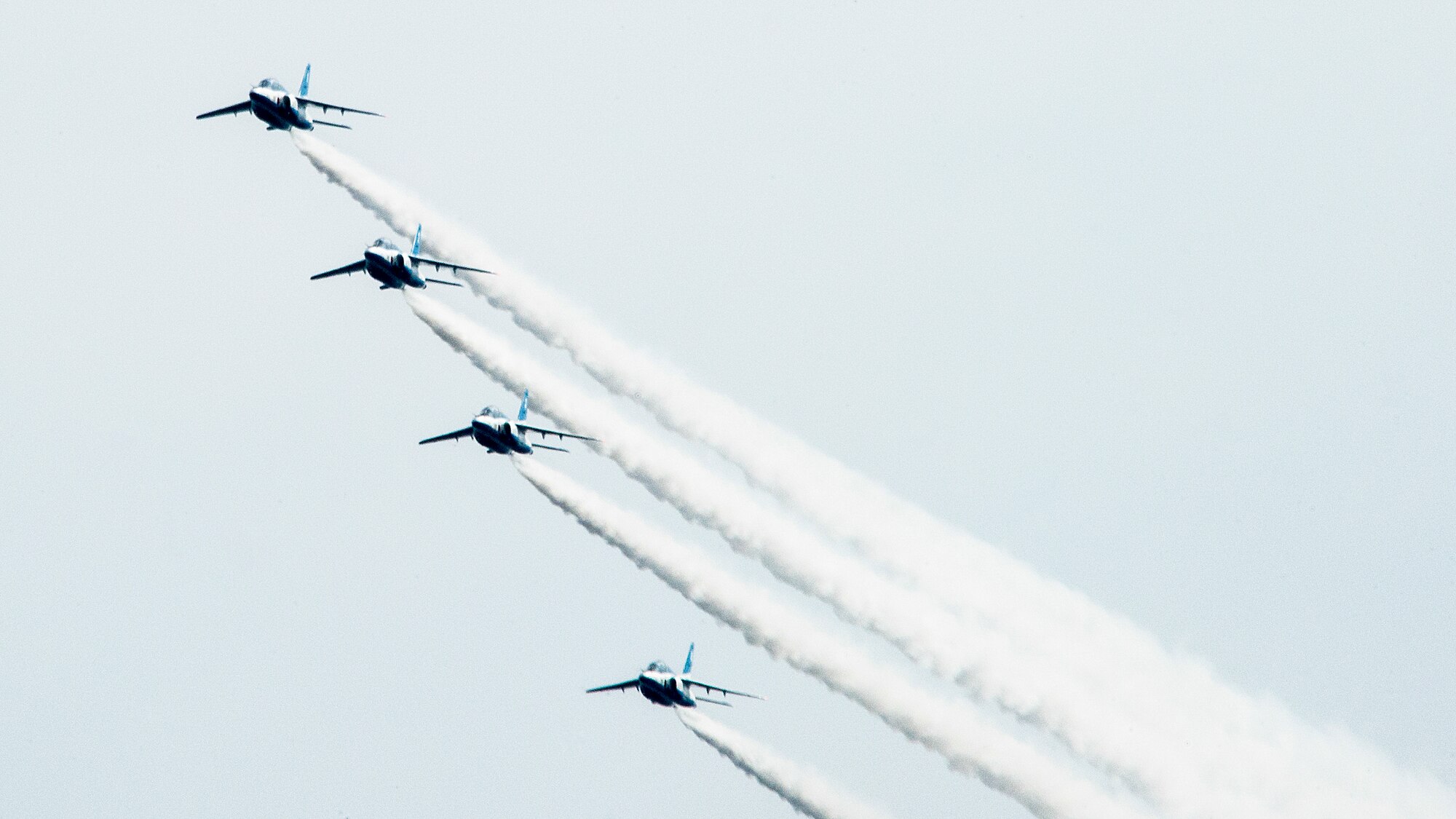 The Japan Air Self-Defense Force aerobatic team, Blue Impulse, leaves smoke-trails in the sky during the annual Iruma Air Show at Iruma Air Base, Japan, Nov. 3, 2013. Blue Impulse used the smoke-trails to sketch artistic patterns in the sky.  (U.S. Air Force photo by Airman 1st Class Soo C. Kim / Released)