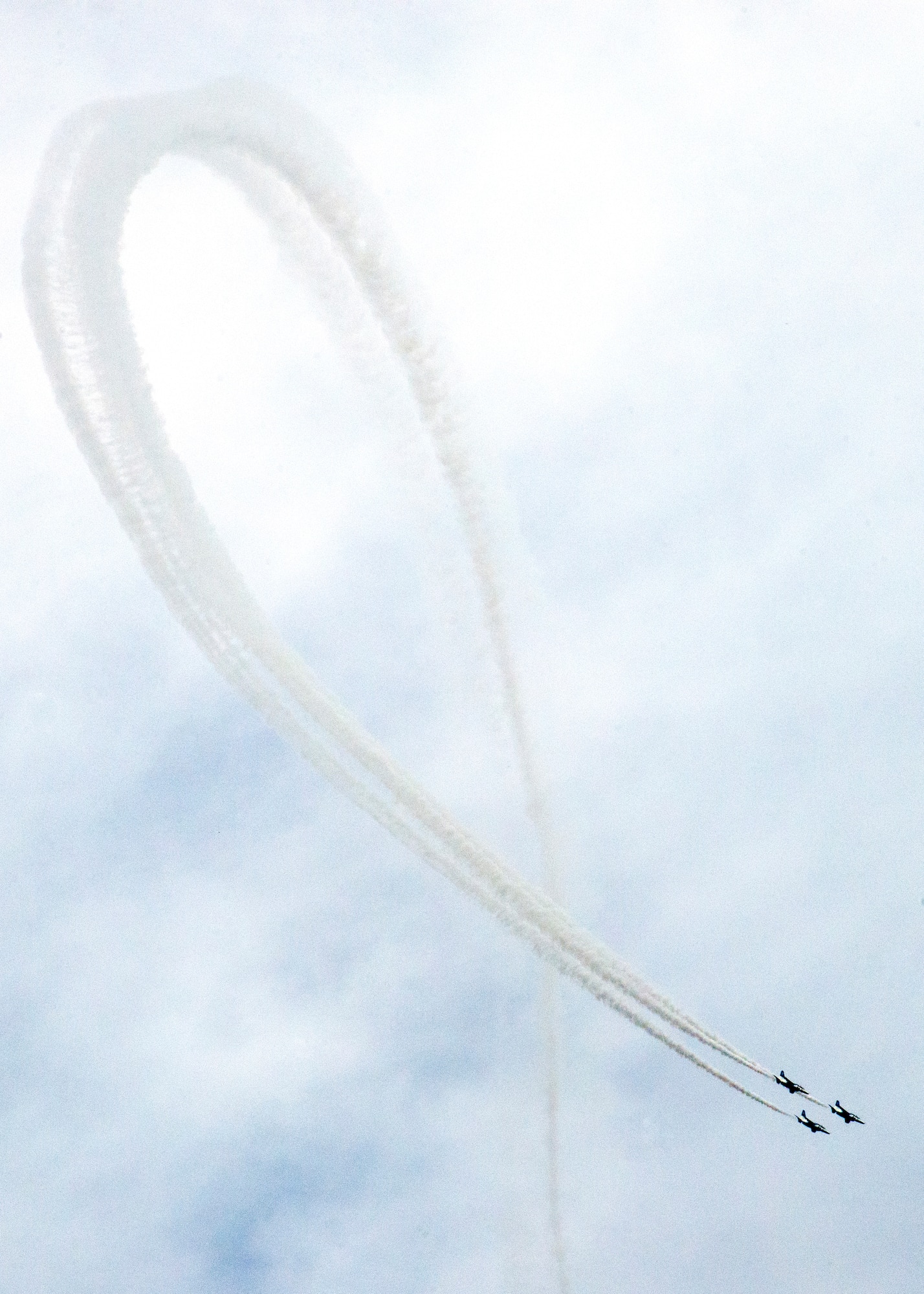The Japan Air Self-Defense Force aerobatic team, Blue Impulse, draws a large ribbon in the sky during the annual Iruma Air Show at Iruma Air Base, Japan, Nov. 3, 2013. Blue Impulse performed many maneuvers during the show. (U.S. Air Force photo by Airman 1st Class Soo C. Kim / Released)