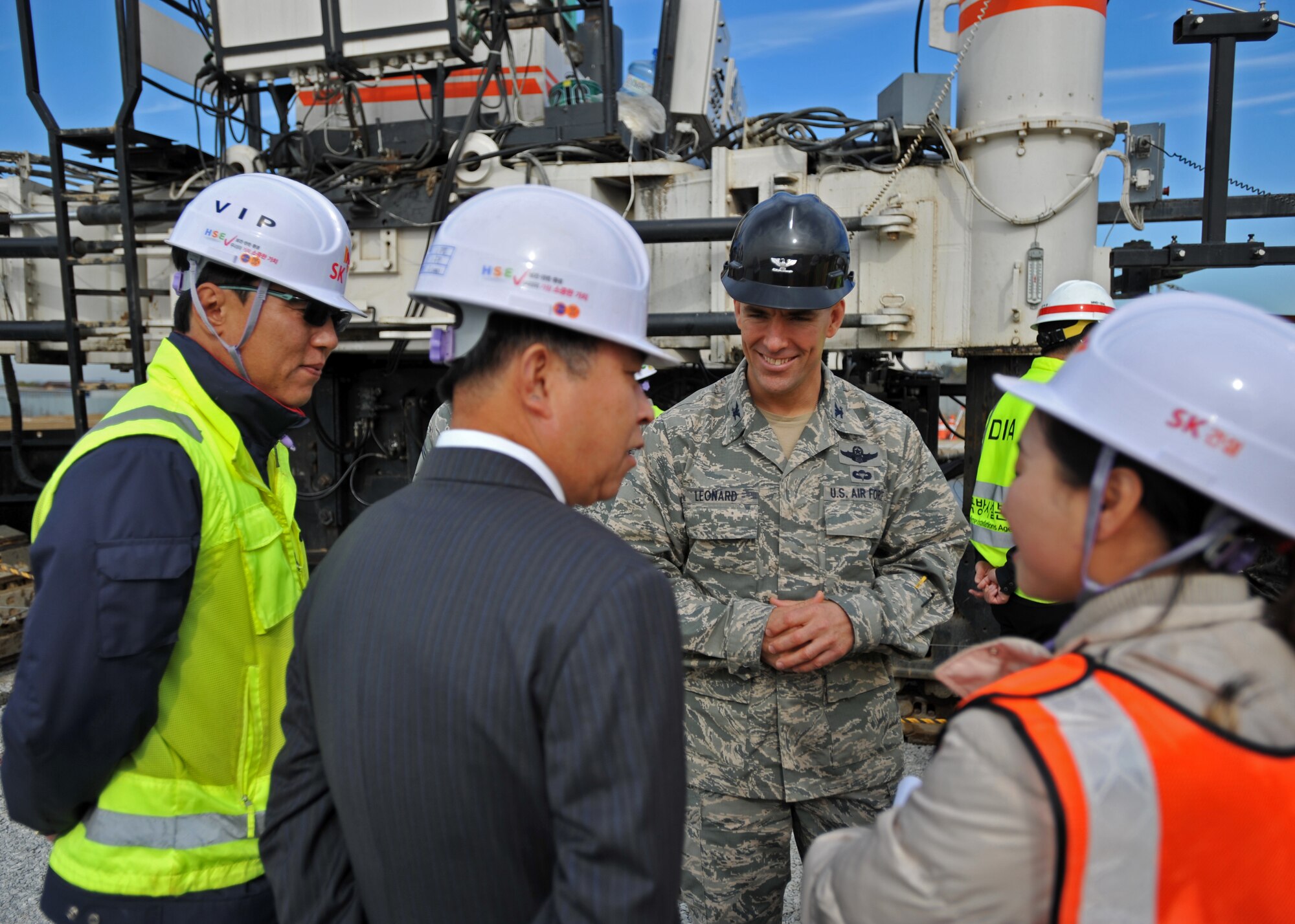 Col. Brook Leonard, 51st Fighter Wing commander, speaks with leadership of the second runway’s construction team at Osan Air Base, Republic of Korea, Nov. 8, 2013. The runway is slated to be operational by December 2014. (U.S. Air Force photo/Senior Airman Siuta B. Ika)