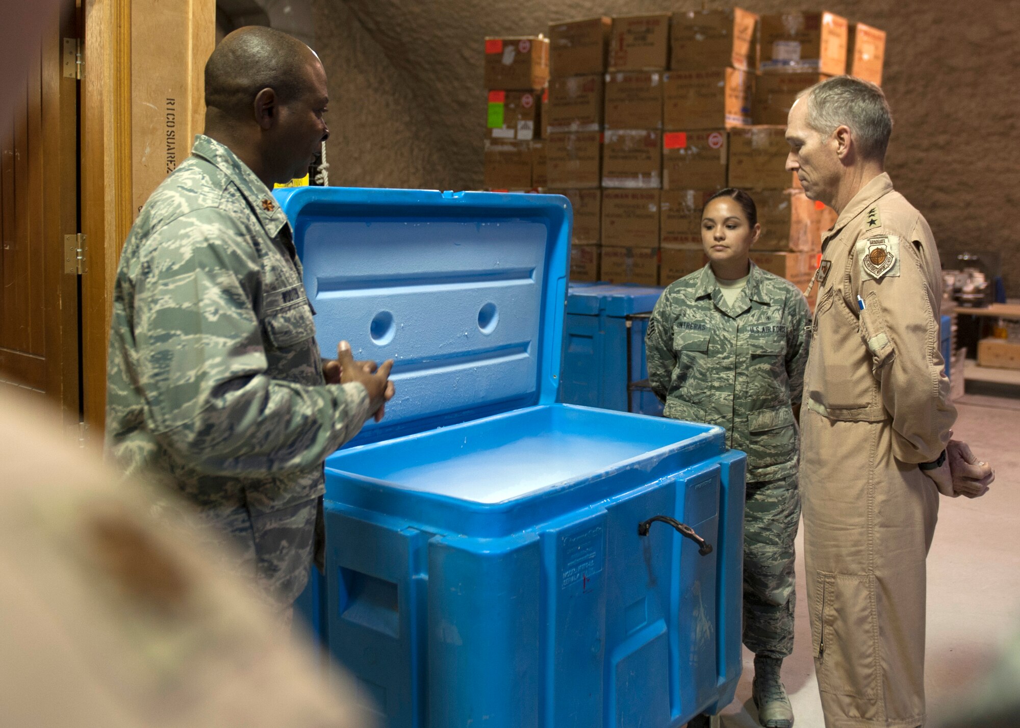 Gen. Mike Hostage is shown the Blood Transshipment Center’s dry ice storage capability during an immersion at the 379th Air Expeditionary Wing in Southwest Asia. In addition to being the hub for blood and products through the AOR, the379th Expeditionary Medical Group BTC is also responsible for supplying dry ice. During his immersion, Hostage visited the Airman and Family Readiness Center, the BTC and the 71st Expeditionary Air Control Squadron. Hostage is the commander of Air Combat Command. (U.S. Air Force photo/Senior Airman Bahja J. Jones) 
