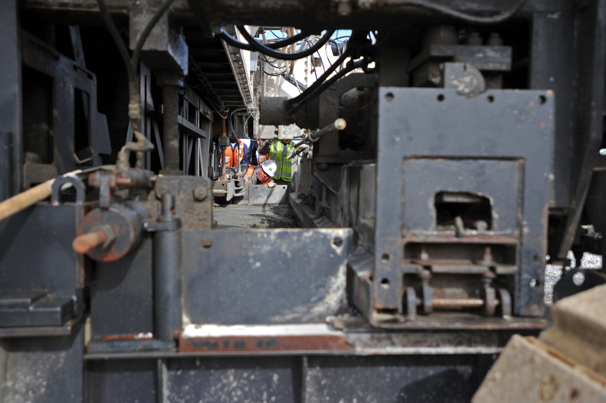 A construction worker watches a paver smooth out the first section of the second runway at Osan Air Base, Republic of Korea, Nov. 8, 2013. The runway is slated to be operational by December 2014. (U.S. Air Force photo/Senior Airman Siuta B. Ika)