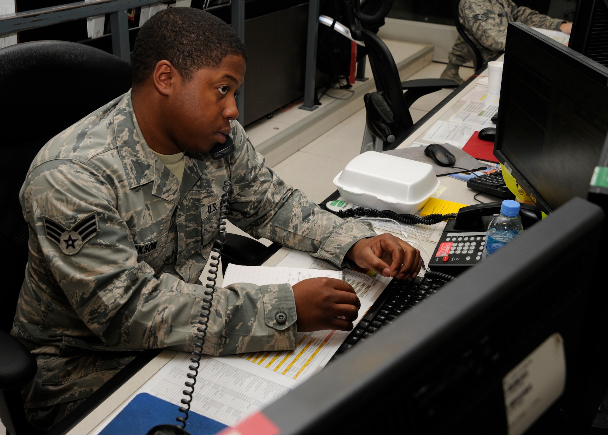Senior Airman Demarius Jackson takes a call on an aircraft status update at the 379th Air Expeditionary Wing in Southwest Asia, Nov. 2, 2013. The Maintenance Operation Center acts as a liaison to leadership in terms of managing and monitoring all maintenance operations for units assigned to the 379th AEW. Jackson is a 379th Expeditionary Maintenance Group MOC technician deployed from Scott Air Force Base, Ill., and an Atlanta native. (U.S. Air Force photo/Senior Airman Bahja J. Jones) 