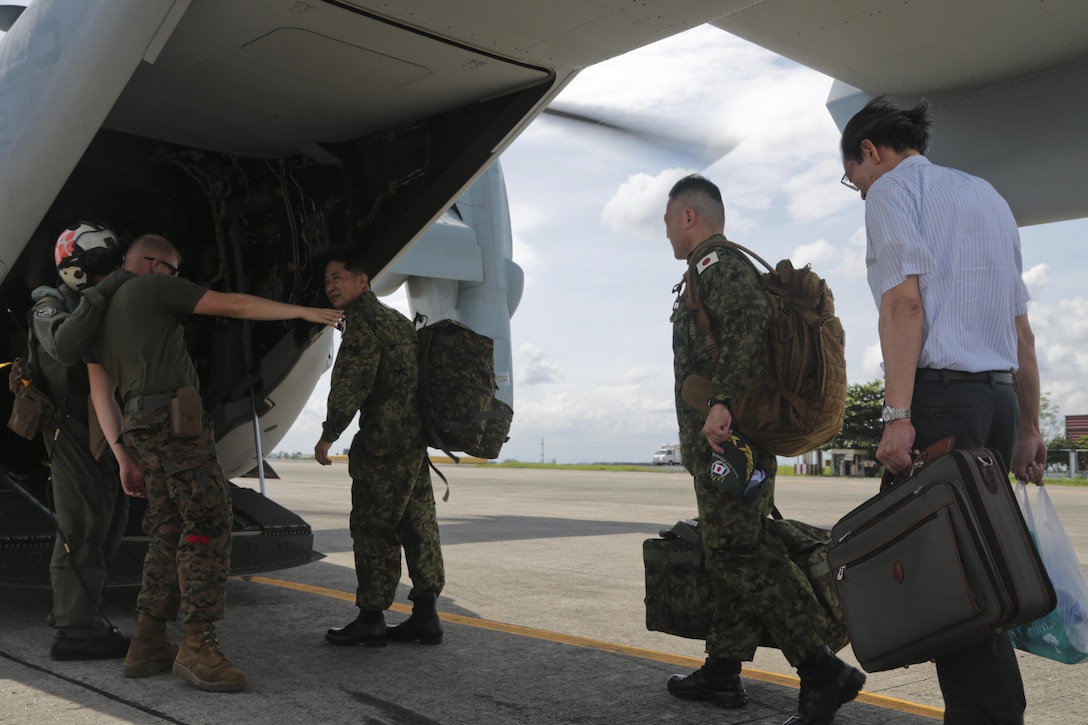 U.S. Marines with 3d Marine Expeditionary Brigade assist Japan Ground Self Defense Force service members board an MV-22B Osprey carrying supplies and personnel from Villamor Air Base, Manila, to areas affected by Typhoon Haiyan, Nov. 14. The U.S. and Philippine Armed Forces have transported more than 384,400 pounds of relief supplies and more than 1,735 displaced personnel. The militaries of the two nations have partnered and trained together for decades, which prepare both forces for the challenges associated with extreme circumstances. (U.S. Marine Corps photo by Lance Cpl. Caleb Hoover)

