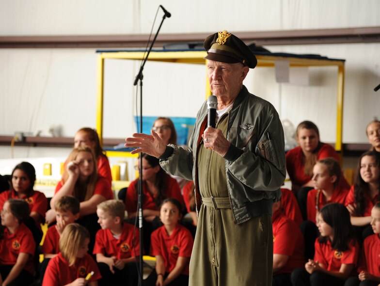 Retired Col. Gail Halvorsen speaks in a hangar, at the South Texas Regional Airport Nov. 9, 2013, prior to the Berlin Airlift re-enactment in Hondo, Texas. More than 250 members of the community and servicemembers participated in the event. 
