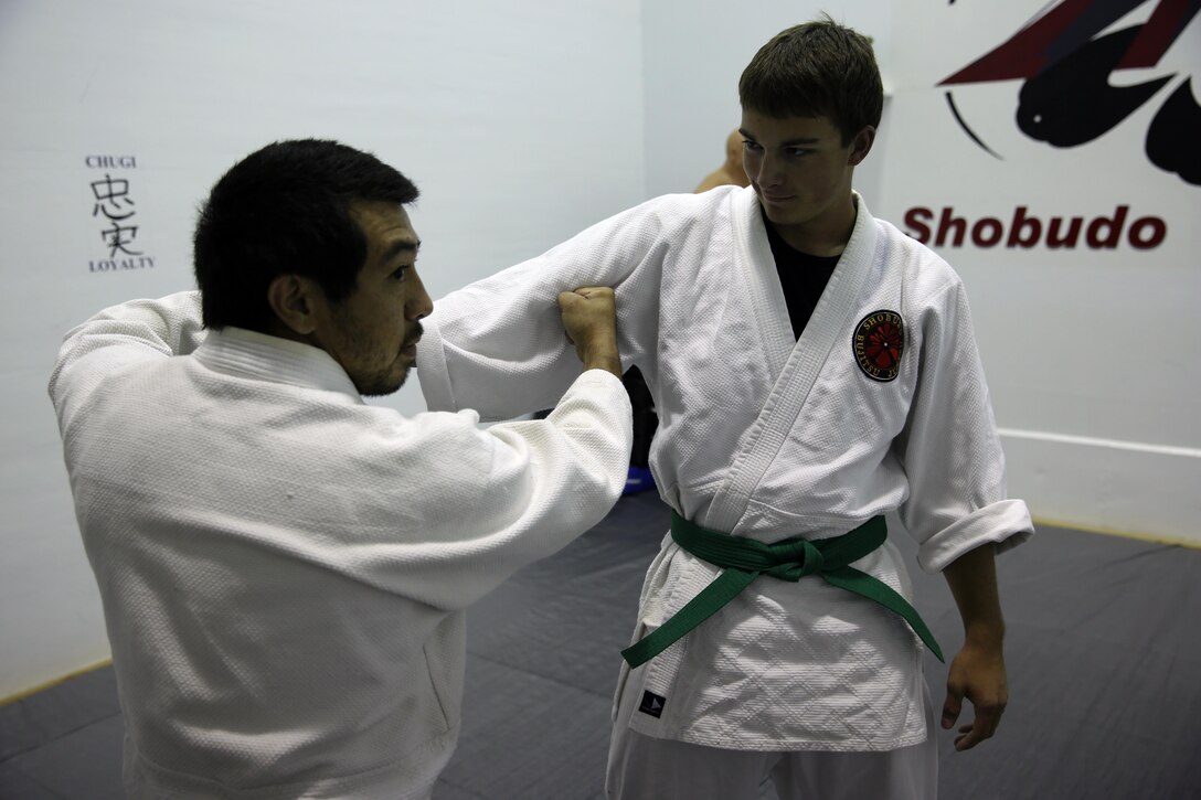 Xavier Turcotte, a Jujitsu instructor, teaches Jujitsu students how to attack pressure points with Gregg Pierson, a Jujitsu student, during a class at building 39, next to the Goettge Memorial Field House, aboard Marine Corps Base Camp Lejeune, Nov. 7. Classes are held Tuesdays and Thursdays from 6:30 p.m. to 9 p.m.