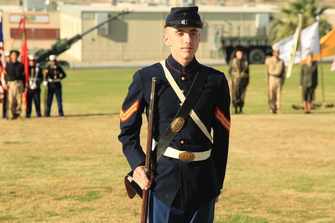 Cpl. Benjamin Cook, air support systems operator, Headquarters Battalion, showcases a Marine Corps uniform from the Civil War era during the Marine Corps Birthday Uniform Pageant at Lance Cpl. Torrey Gray Field Nov. 7, 2013.