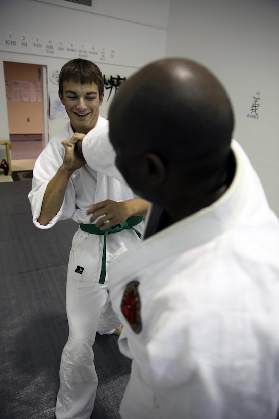 Gregg Pierson and Donald Hatch, Jujitsu students, practice self defense techniques during a class at building 39, next to the Goettge Memorial Field House, aboard Marine Corps Base Camp Lejeune, Nov. 7. Classes are held Tuesdays and Thursdays from 6:30 p.m. to 9 p.m.