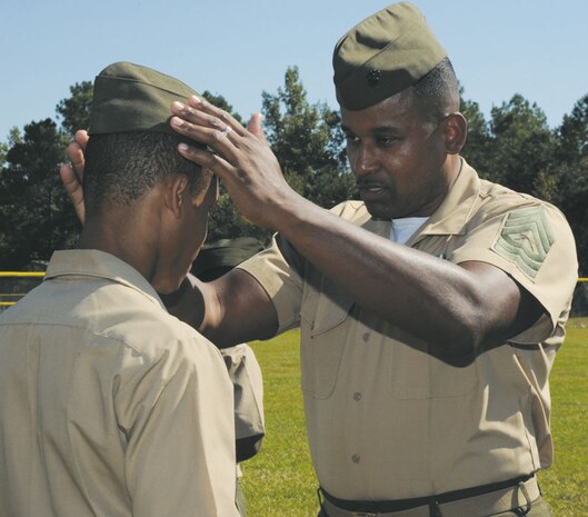 Westover High School Junior Reserve Officers Training Corps unit held their annual inspection, Oct. 24.  As the 145 cadets filed onto the baseball field, eight senior Marines assigned to Marine Corps Logistics Command stood ready with their inspection clipboards in hand.