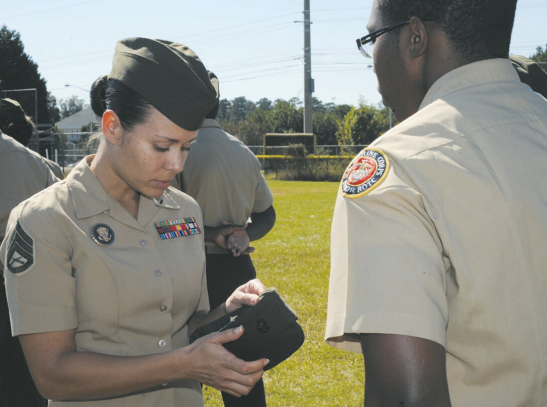 Westover High School Junior Reserve Officers Training Corps unit held their annual inspection, Oct. 24.  As the 145 cadets filed onto the baseball field, eight senior Marines assigned to Marine Corps Logistics Command stood ready with their inspection clipboards in hand.