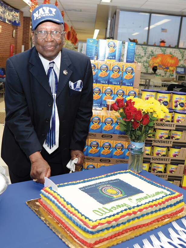 J. D. Armstrong, U.S. Navy retired and Vietnam veteran, cuts a slice of cake during the commemoration ceremony of the 50th anniversary of the Vietnam War, Nov. 5 at Marine Corps Logistics Base Albany’s Commissary.