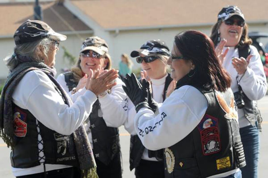 Members of the Jacksonville Rolling Thunder Chapter NC-5 cheer on parade participants during the 18th annual Jacksonville Veterans Day Parade, Nov. 9. 