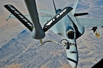 A U.S. Navy F/A-18 Hornet refuels from a KC-135 Stratotanker in Southwest Asia, Oct. 1, 2013. The stratotanker is from the Wisconsin Air National Guard's 128th Air Refueling Wing, Milwaukee.