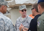 U.S. Air Force Lt. Gen. Joseph L. Lengyel, center, the vice chief of the National Guard Bureau, receives a briefing on Vigilant Guard training scenarios during a visit to Camp Blanding Joint Training Center, Fla., May 19, 2013. Lengyel spoke today about the shutdown’s effect on Guard readiness.