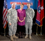 Maj. Gen. Max Haston, the adjutant general of Tennessee, congratulates 2nd Lt. Ian Joyner and his wife Jennifer for being the 1,000th Tennessee National Guard member hired through the Job Connection Education Program.