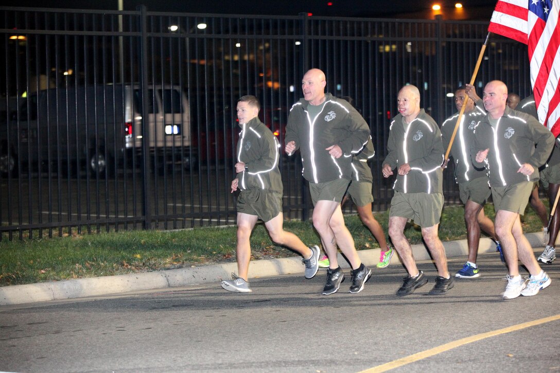 Sgt. Maj. Micheal P. Barrett, the 17th Sergeant Major of the Marine Corps, and wounded warriors Sgt. Isaac Gallegos and Cpl. Kyle Carpenter, lead Marines on a run to the Marine Corps War Memorial in Arlington, Va., on Nov. 8, 2013, in celebration of the Marine Corps’ 238th birthday. (U.S. Marine Corps photo by Sgt. Marionne T. Mangrum)