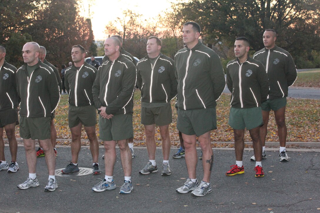 Sgt. Maj. Micheal P. Barrett, the 17th Sergeant Major of the Marine Corps, and wounded warriors Sgt. Isaac Gallegos and Cpl. Kyle Carpenter, lead Marines on a run to the Marine Corps War Memorial in Arlington, Va., on Nov. 8, 2013, in celebration of the Marine Corps’ 238th birthday. (U.S. Marine Corps photo by Sgt. Marionne T. Mangrum)