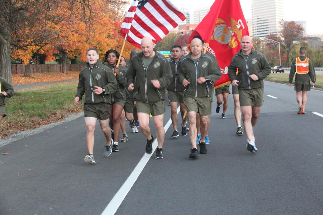 Sgt. Maj. Micheal P. Barrett, the 17th Sergeant Major of the Marine Corps, and wounded warriors Sgt. Isaac Gallegos and Cpl. Kyle Carpenter, lead Marines on a run to the Marine Corps War Memorial in Arlington, Va., on Nov. 8, 2013, in celebration of the Marine Corps’ 238th birthday. (U.S. Marine Corps photo by Sgt. Marionne T. Mangrum)
