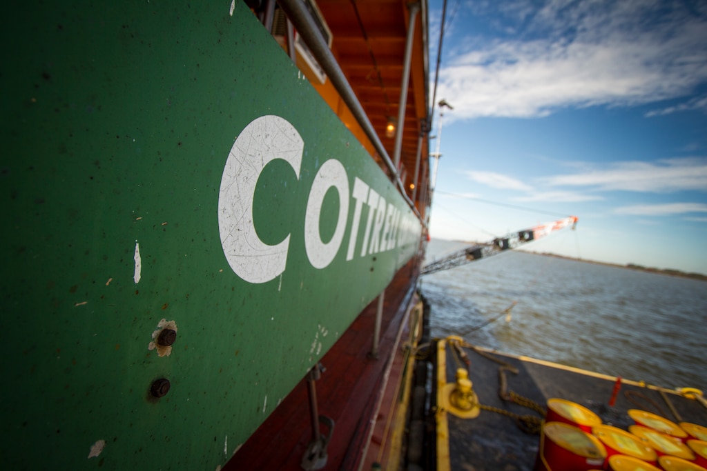 WILLIAMSBURG, Va. -- The crew of the Cottrell Contracting Corporation Dredge Marion works to remove shoals from the James River federal navigation channel just off shore from James City County, Va., Nov. 6 2013. The river plays a role in the economies of Richmond and Hopewell, providing a navigation channel of 25 feet deep for ships to move goods to and from the inland ports. (U.S. Army photo/Patrick Bloodgood)