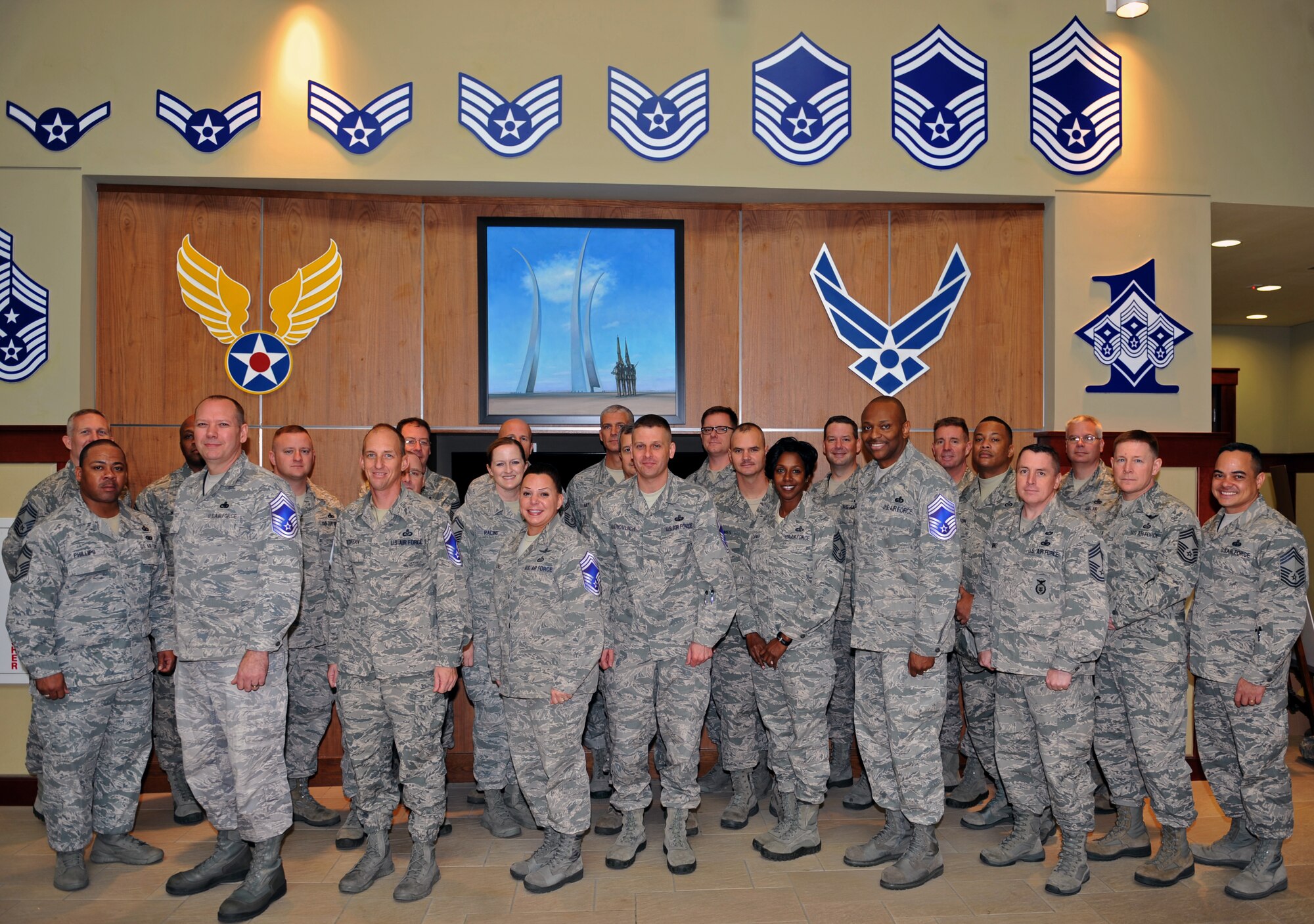Team Osan’s newest chief master sergeant-selects pose for a photo with members of the Chief’s Group at Osan Air Base, Republic of Korea, Nov. 15, 2013. Of the 2,023 senior master sergeants eligible for promotion to chief Air Force-wide, 400 were selected – eight of whom currently serve as part of Team Osan. (U.S. Air Force photo/Senior Airman Siuta B. Ika)