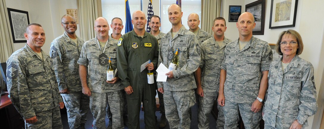 15th Wing chief master sergeants welcome team Hickam’s newest chief master sergeant selects, (center from left to right) Senior Master Sgt. Todd Larsen, 747th Communications Squadron flight chief, Senior Master Sgt. Bill Fitch, 96th Air Refueling Squadron superintendent, and Senior Master Sgt. Todd Kirsch, 647th Civil Engineer Squadron operations superintendent this week, at the 15th Wing headquarters building, at Joint Base Pearl Harbor-Hickam, Hawaii. By federal law, only 1.25 percent of the Air Force enlisted force may hold the rank of chief master sergeant. (U.S. Air Force photo/Tech. Sgt. Jerome S. Tayborn)