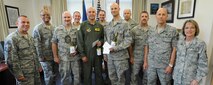 15th Wing chief master sergeants welcome team Hickam’s newest chief master sergeant selects, (center from left to right) Senior Master Sgt. Todd Larsen, 747th Communications Squadron flight chief, Senior Master Sgt. Bill Fitch, 96th Air Refueling Squadron superintendent, and Senior Master Sgt. Todd Kirsch, 647th Civil Engineer Squadron operations superintendent this week, at the 15th Wing headquarters building, at Joint Base Pearl Harbor-Hickam, Hawaii. By federal law, only 1.25 percent of the Air Force enlisted force may hold the rank of chief master sergeant. (U.S. Air Force photo/Tech. Sgt. Jerome S. Tayborn)