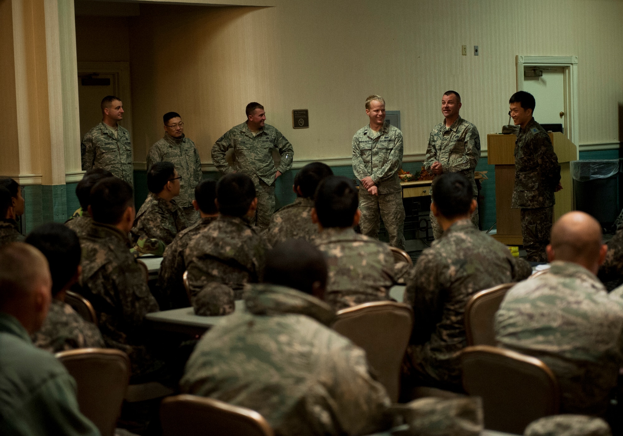 Master Sgt. Jeffrey Jones, 8th Civil Engineer Squadron, speaks during a debrief of a combined Airfield Damage Repair Exercise at Kunsan Air Base, Republic of Korea, Nov. 14, 2013. The exercise with ROK air force's 1st Civil Engineer Squadron allowed members of both air forces to work together, learn different methods and become more proficient with airfield repairs. (U.S. Air Force photo by Senior Airman Clayton Lenhardt/Released)