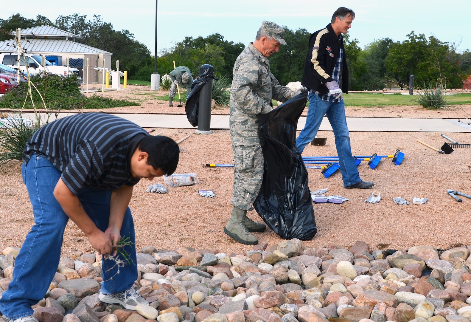 Chris Alvarez, Chaplain (Col.) Steven McCain and Chris Kelly participate in the 502nd Air Base Wing’s first Pride Day Nov. 8 at Joint Base San Antonio-Fort Sam Houston. Members of the 502nd Air Base Wing and the Mission Support Groups throughout JBSA cleaning areas both inside and outside their facilities. (Photo by Lori Newman, JBSA-Fort Sam Houston Public Affairs)