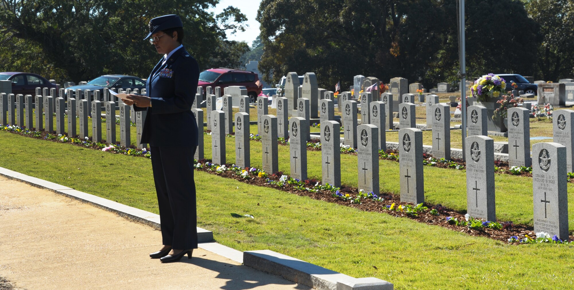 Lt. Col. Donnette Boyd (right), U.S. Air Force student at Air War College, part of the Carl A. Spaatz Center for Officer Education locate at Maxwell Air Force Base,  reads the pilot’s prayer in French for the annual Remembrance Day Ceremony held at Oakwood Cemetery in Montgomery, Ala.  The ceremony is held to mark the sacrifice of 78 Royal Air Force and 20 French Air Force flight cadets, who died from training accidents in the southeast United States during World War II. (U.S. Air Force photo by Staff Sgt. Gregory Brook)
