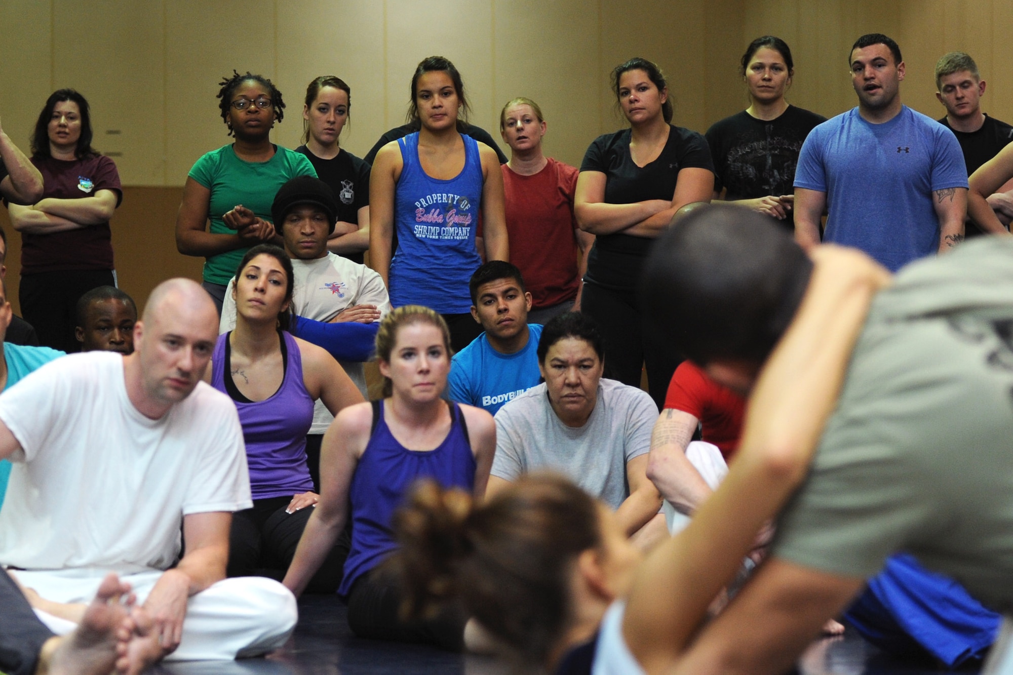 Eve Torres and Rener Gracie, both Gracie Academy Women Empowered self-defense seminar instructors, demonstrate a shrimp drill and jump-back base get-up during the weeklong seminar Nov. 12. They taught nearly 100 Team Malmstrom members how to neutralize the 15 most common sexual assault attacks. (U.S.  Air Force photo/Senior Airman Katrina Heikkinen)