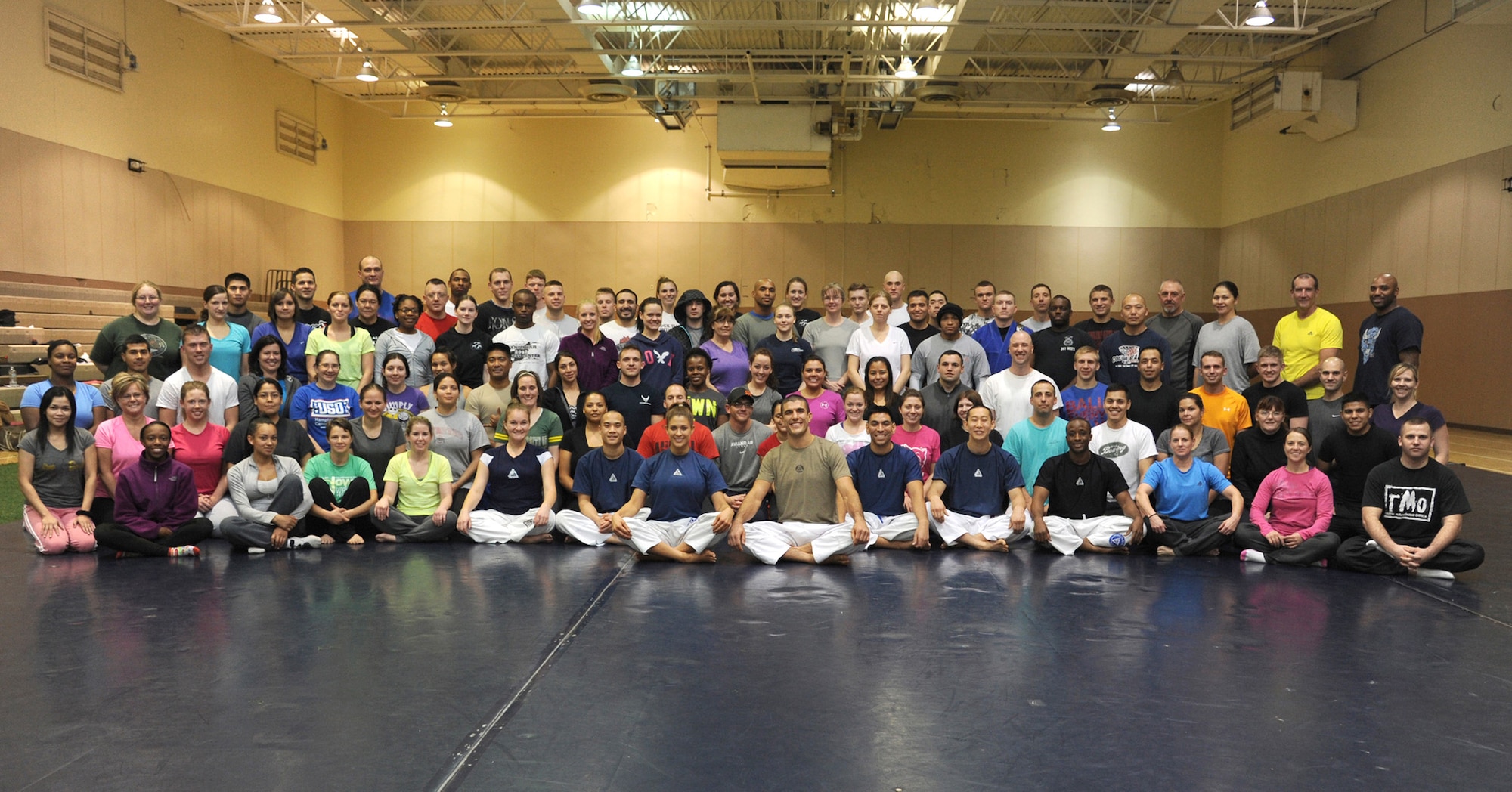 Nearly 100 Team Malmstrom members pose for a group photo on the first day of the Gracie Academy Women Empowered Gracie Defense Systems seminar at the fitness center Nov. 11. The weeklong class was taught by Eve Torres, Gracie Academy instructor, and Rener Gracie, Gracie Academy head instructor. (U.S. Air Force photo/Senior Airman Katrina Heikkinen)