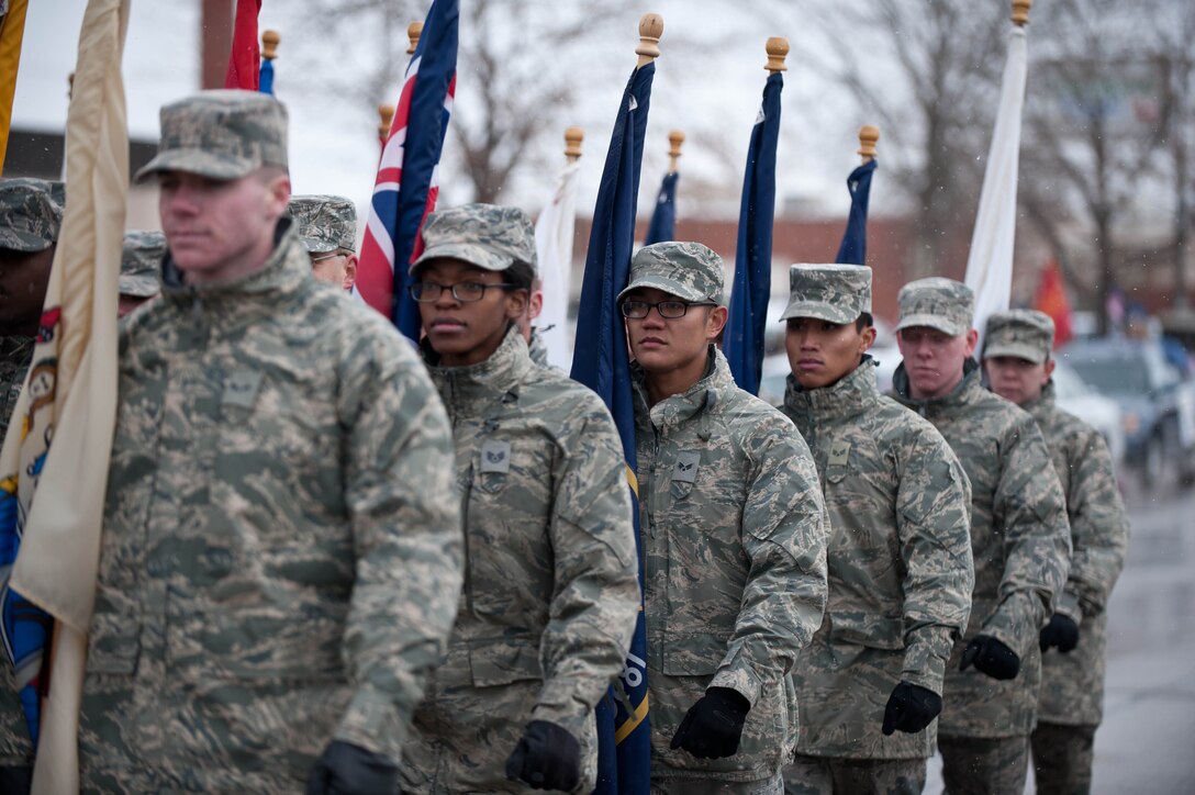 Airmen from Ellsworth Air Force Base march down Main Street during the Veterans Day parade at Rapid City, S.D., Nov. 11, 2013. During the parade, military members, their families and area residents joined base and local leaders to honor all veterans – past and present. (U.S. Air Force photo by Senior Airman Zachary Hada/Released)