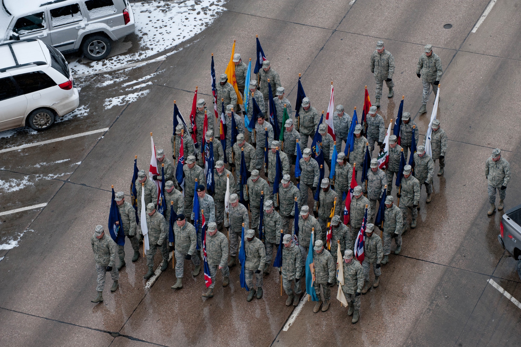 Airmen from Ellsworth Air Force Base march down Main Street during the Veterans Day parade at Rapid City, S.D., Nov. 11, 2013. Originally known as Armistice Day, Veterans Day was established in 1954 and symbolizes the sacrifice and service of our nation’s veterans. (U.S. Air Force photo by Senior Airman Zachary Hada/Released)