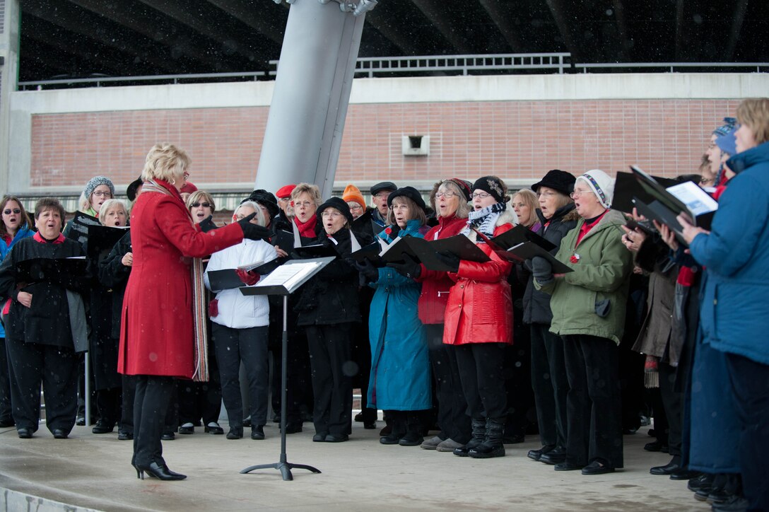 Chorus singers from the Dakota Choral Union serenade military members, their families and area residents during the Veterans Day parade in Rapid City, S.D., Nov. 11, 2013. During the parade, 50 Airmen marched down Main Street carrying flags representing each state in the U.S. (U.S. Air Force photo by Senior Airman Zachary Hada/Released)