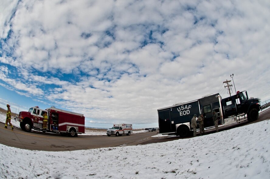 Ellsworth Airmen respond to a Chemical, Biological, Radiological, Nuclear and Explosive training exercise at Ellsworth Air Force Base, S.D., Nov. 6, 2013. The exercise was designed to enable emergency response crews to hone their skills and quickly and effectively respond to CBRNE incidents. (U.S. Air Force photo by Senior Airman Zachary Hada/Released)